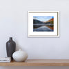 Fine art print of the Upper lake at Glendalough in white frame on a grey wall by Irish artist Francis Leavey