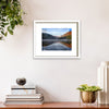 Fine art print of the Upper lake at Glendalough in white frame on a cream wall by Irish artist Francis Leavey